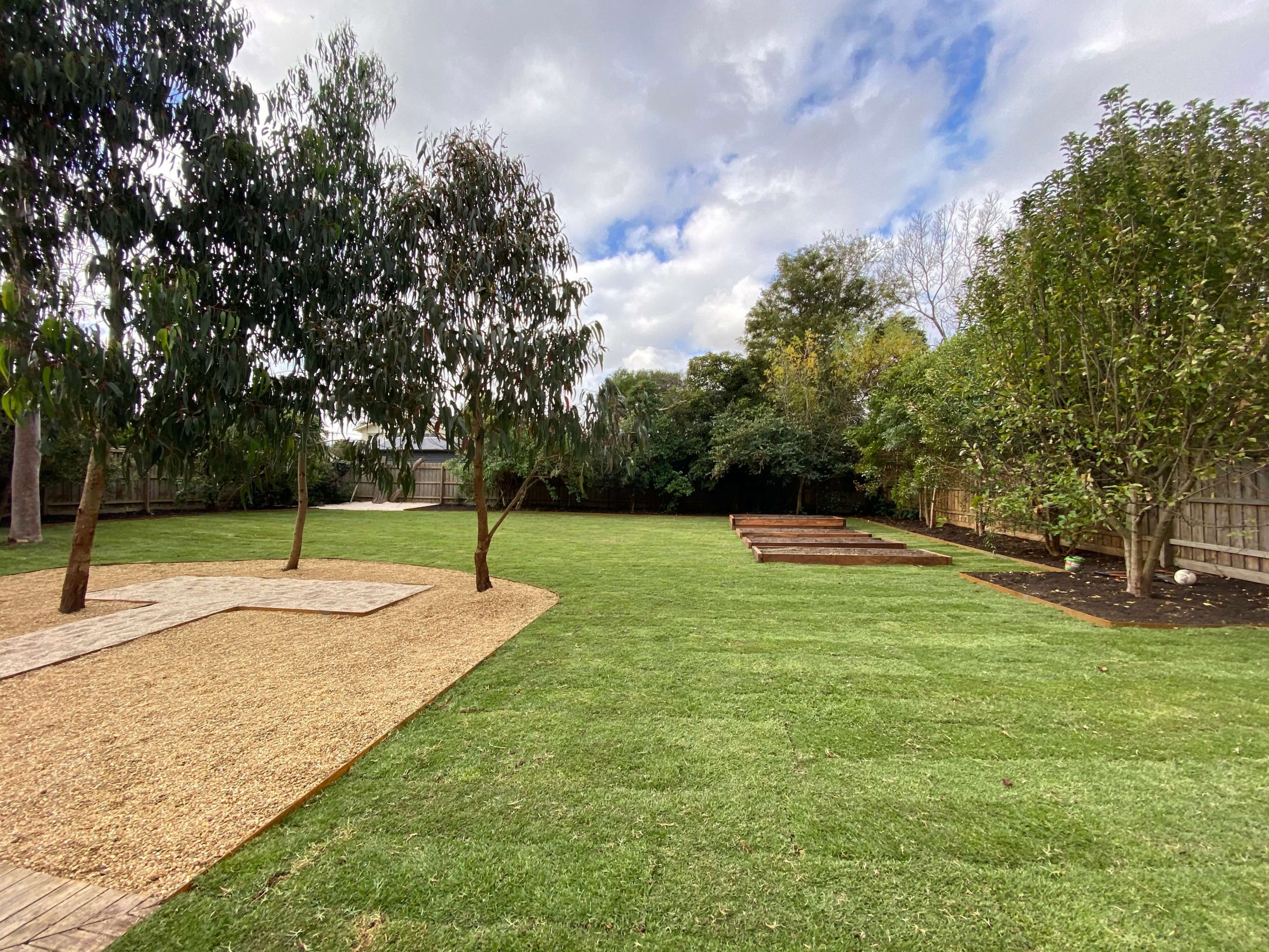 turf lawn corten edging pebbles
